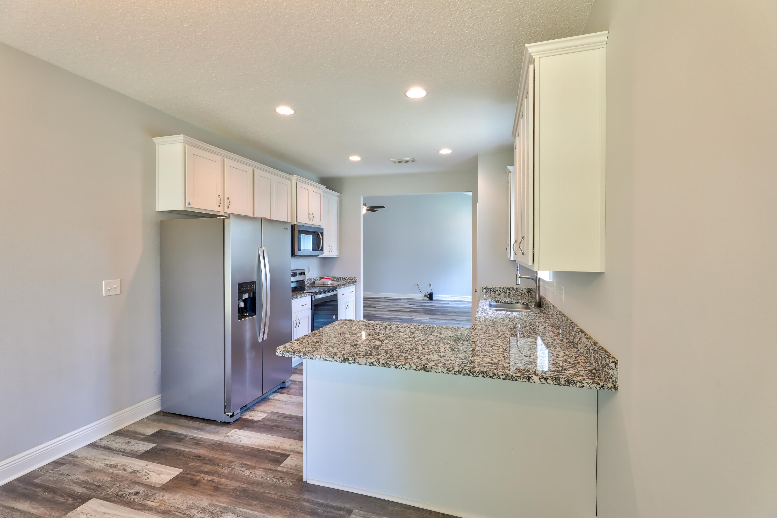 6160 Hayes Drive Crestview, FL 32539 - Photo 23 of 45 a kitchen with stainless steel appliances granite countertop a refrigerator and a sink