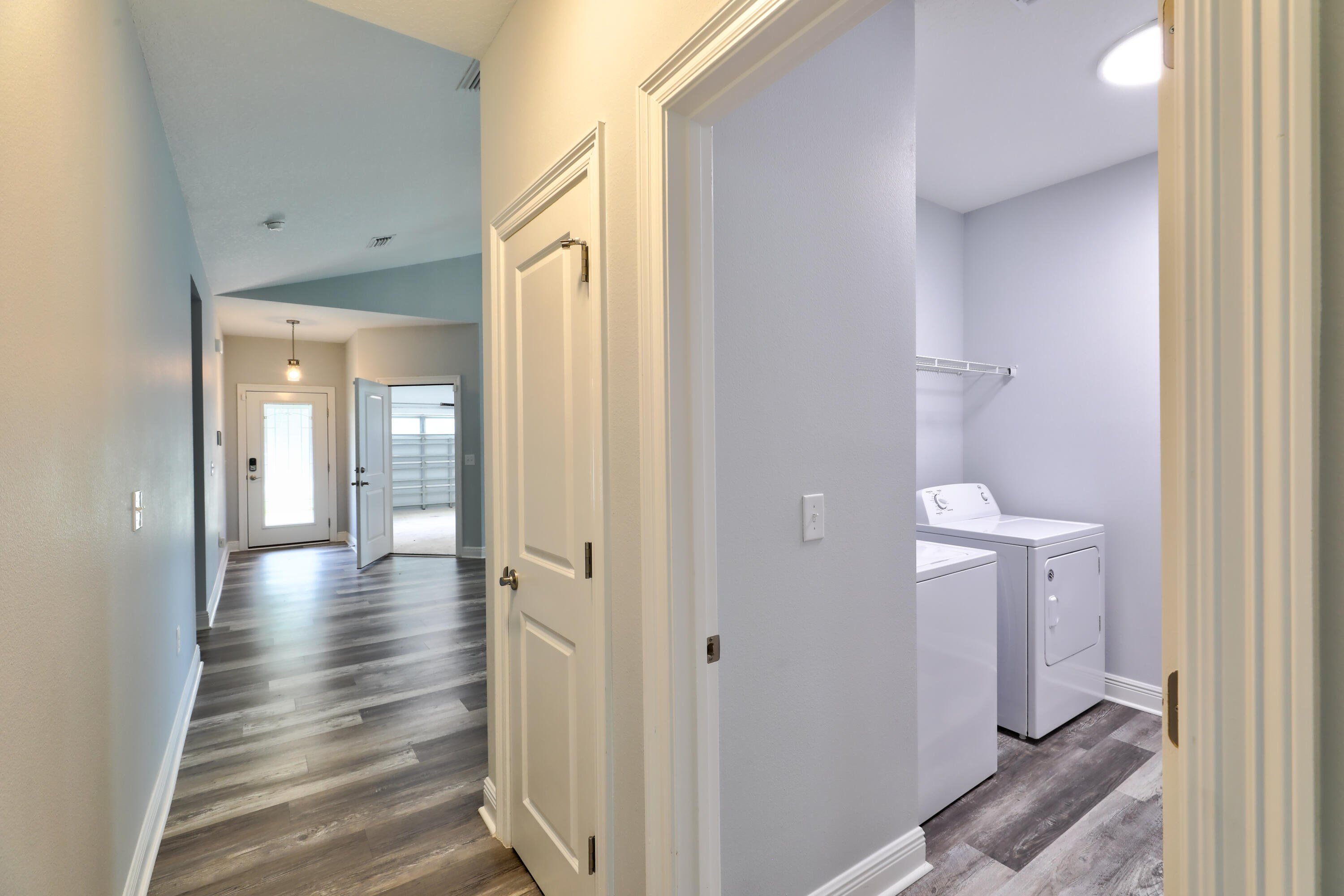 6160 Hayes Drive Crestview, FL 32539 - Photo 30 of 45 a view of a hallway with wooden floor and closet