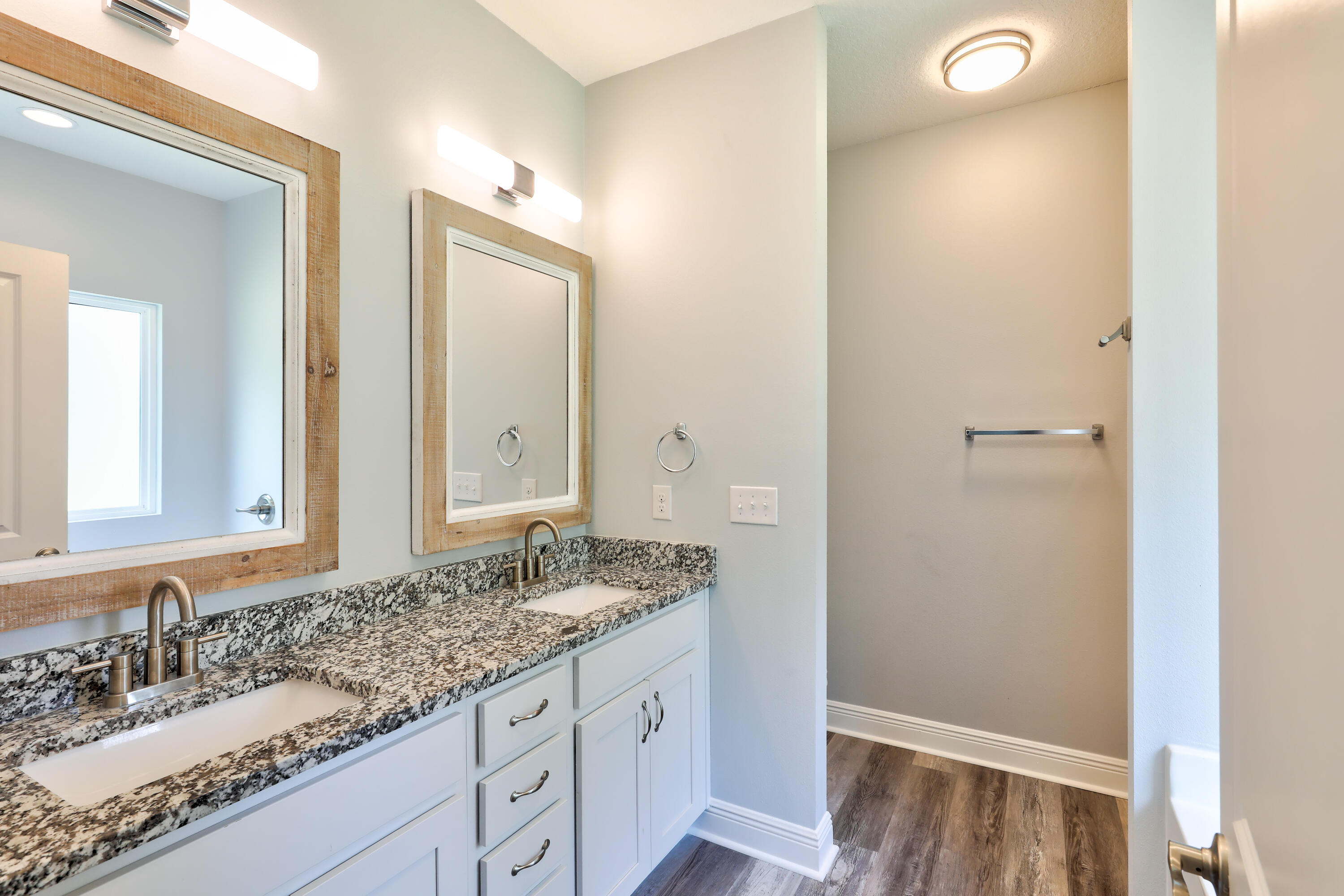 6160 Hayes Drive Crestview, FL 32539 - Photo 34 of 45 a bathroom with a granite countertop sink and a mirror