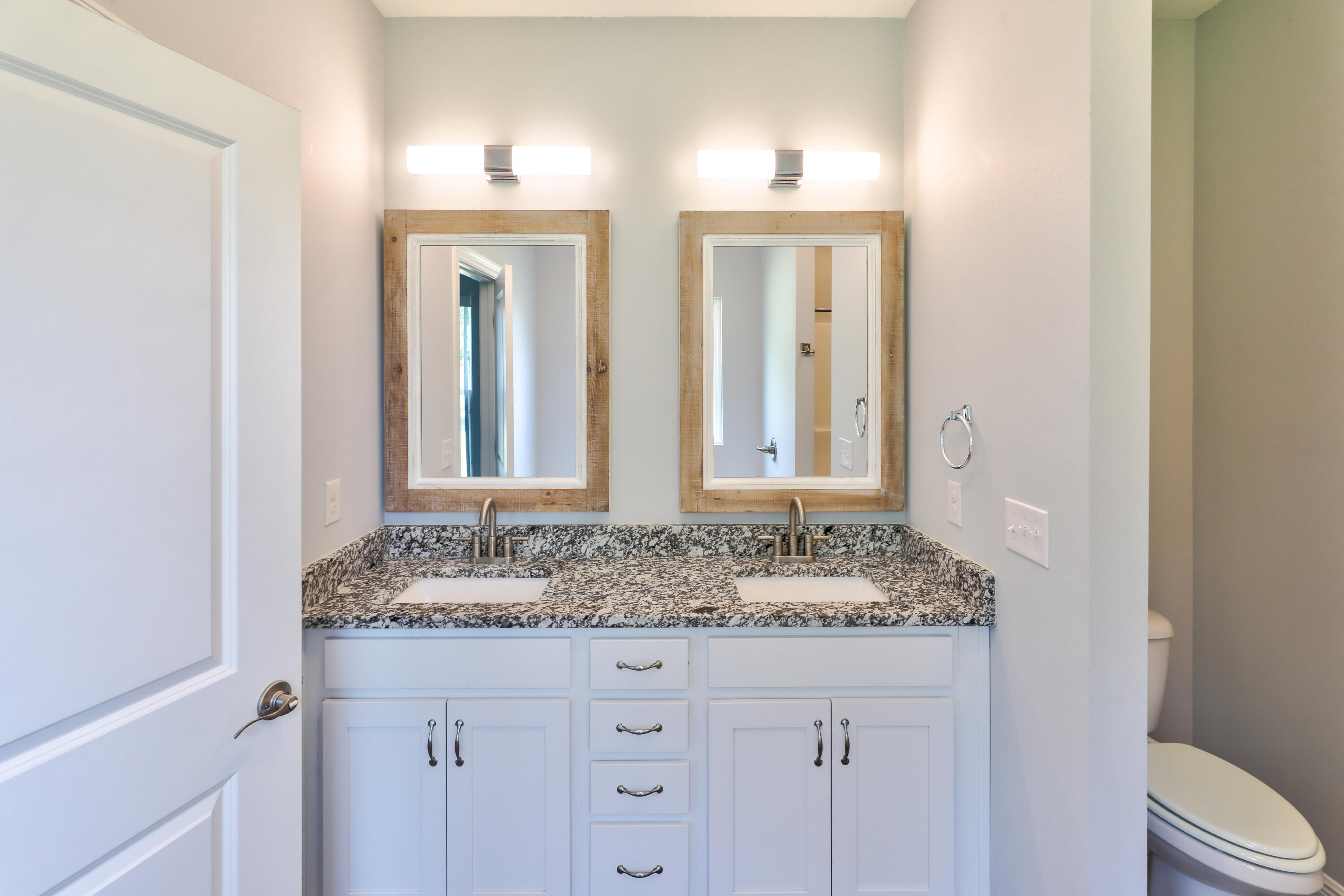 6160 Hayes Drive Crestview, FL 32539 - Photo 37 of 45 a bathroom with a granite countertop sink and a mirror