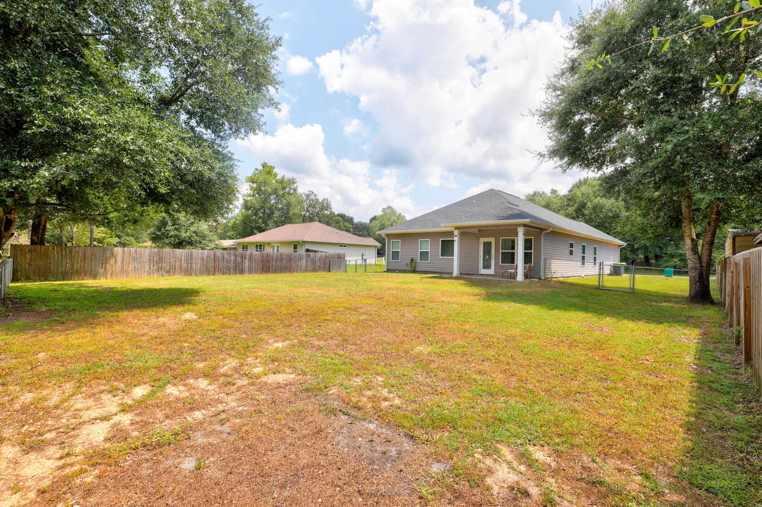 6160 Hayes Drive Crestview, FL 32539 - Photo 39 of 45 a front view of a house with a yard