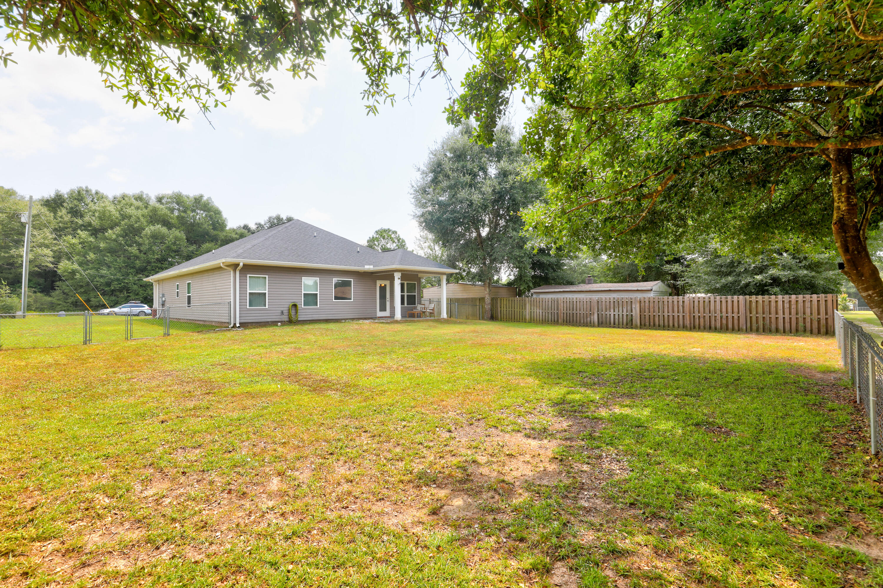 6160 Hayes Drive Crestview, FL 32539 - Photo 41 of 45 a front view of house with a garden