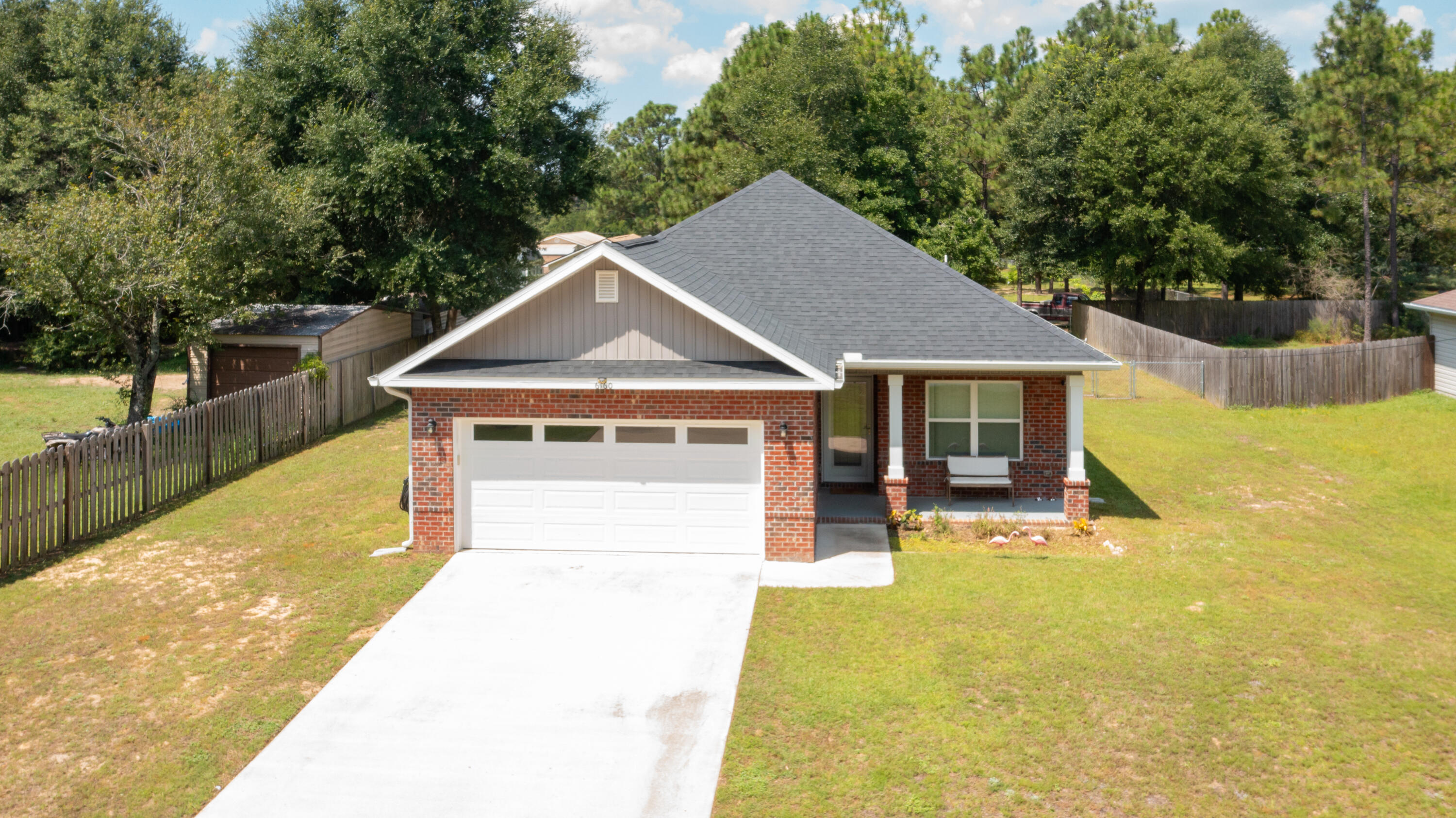 6160 Hayes Drive Crestview, FL 32539 - Photo 7 of 45 a front view of a house with a yard outdoor seating and garage