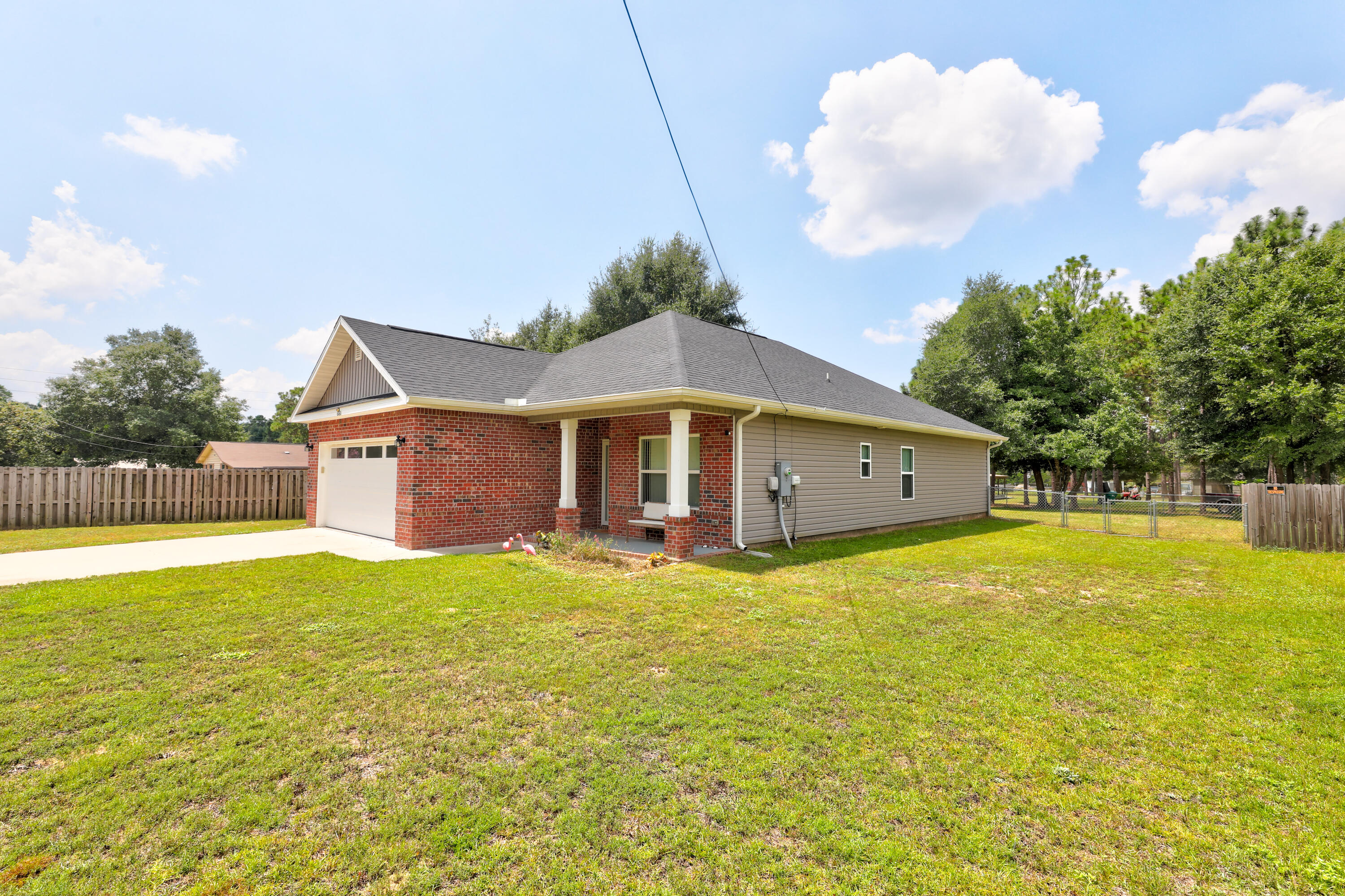 6160 Hayes Drive Crestview, FL 32539 - Photo 9 of 45 a front view of house with yard and trees in the background