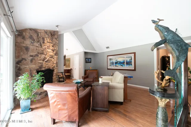 a kitchen with a sink a stove top oven and cabinetry