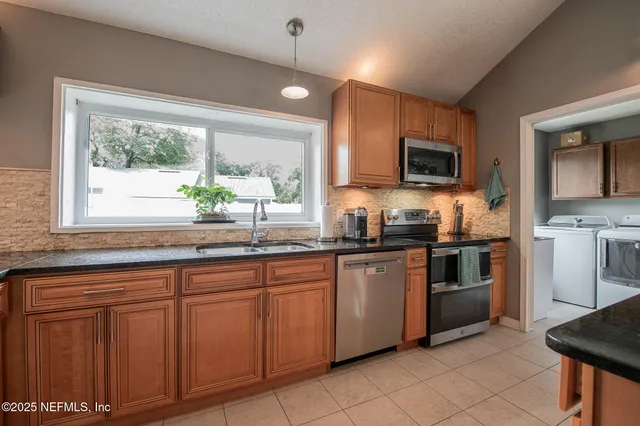 a spacious bathroom with a granite countertop sink mirror and toilet