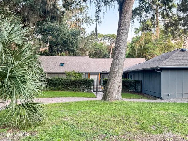 a backyard of a house with seating space
