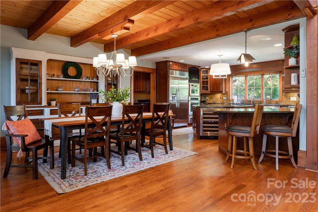 649 Morgan Hill Road Fairview, NC 28730 - Photo 12 of 48 a view of a dining room with furniture window and wooden floor
