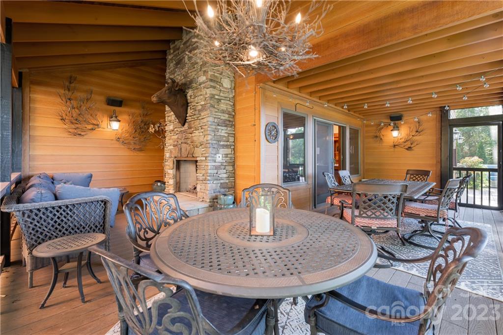 649 Morgan Hill Road Fairview, NC 28730 - Photo 15 of 48 a dining room with furniture and wooden floor