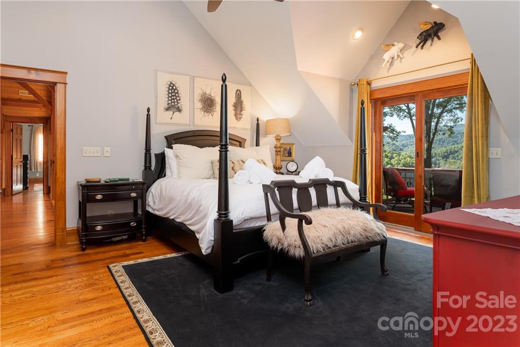 649 Morgan Hill Road Fairview, NC 28730 - Photo 19 of 48 a bed room with a bed and a couch