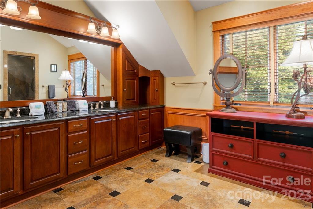 649 Morgan Hill Road Fairview, NC 28730 - Photo 21 of 48 a bathroom with a sink and a mirror
