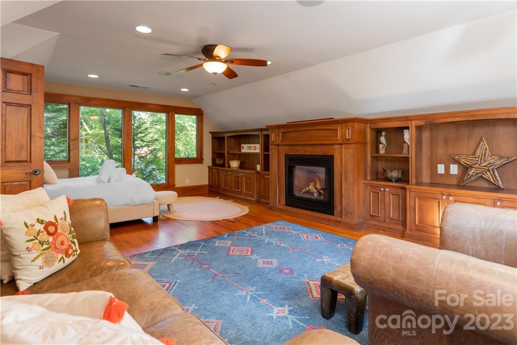 649 Morgan Hill Road Fairview, NC 28730 - Photo 23 of 48 a living room with furniture and a fireplace