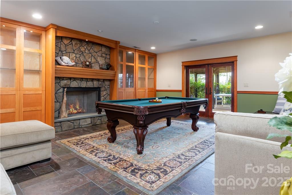 649 Morgan Hill Road Fairview, NC 28730 - Photo 25 of 48 a living room with furniture and a fireplace