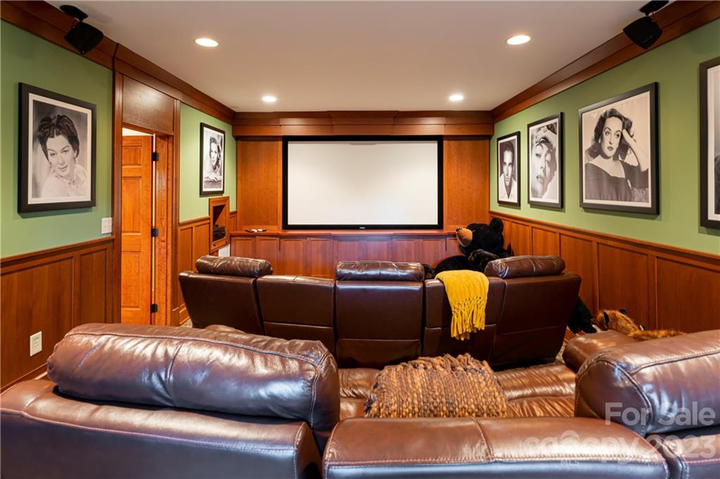 649 Morgan Hill Road Fairview, NC 28730 - Photo 26 of 48 a living room with furniture and wall paintings