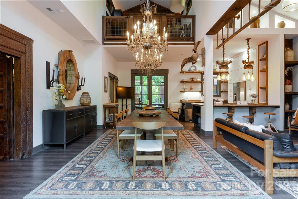 649 Morgan Hill Road Fairview, NC 28730 - Photo 32 of 48 a living room with furniture a chandelier and a rug