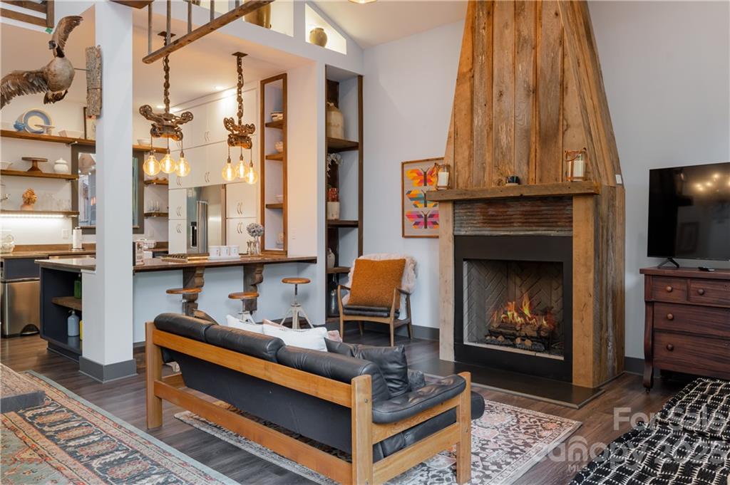 649 Morgan Hill Road Fairview, NC 28730 - Photo 33 of 48 a living room with furniture and a fireplace