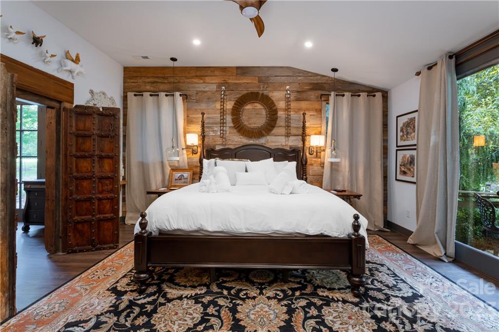 649 Morgan Hill Road Fairview, NC 28730 - Photo 34 of 48 a bed sitting in a room next to a window