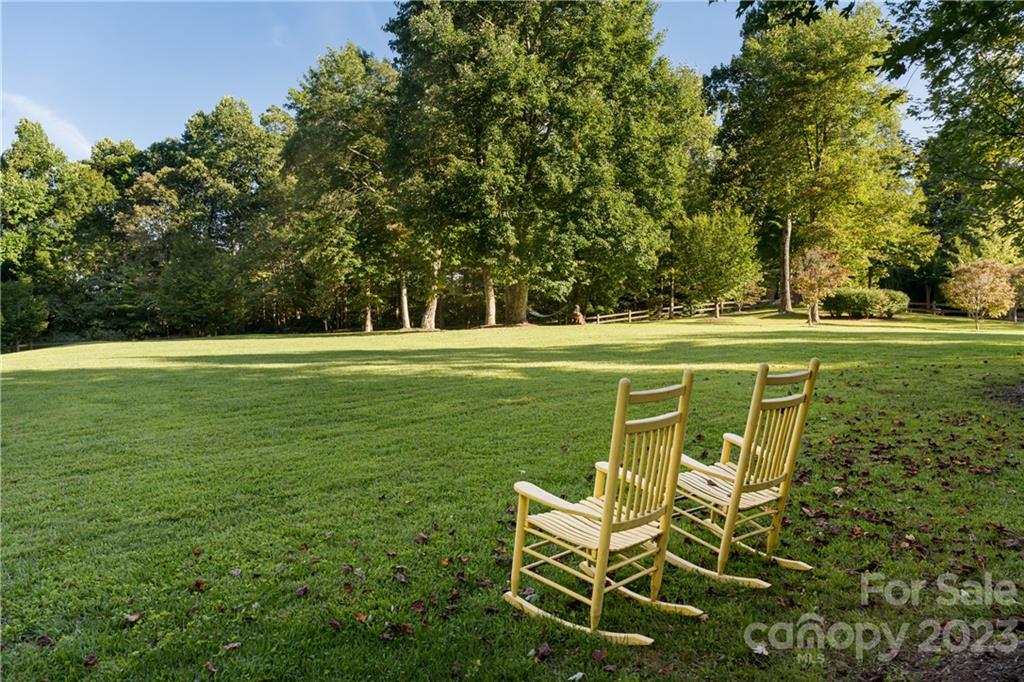 649 Morgan Hill Road Fairview, NC 28730 - Photo 39 of 48 a view of a golf course with chairs
