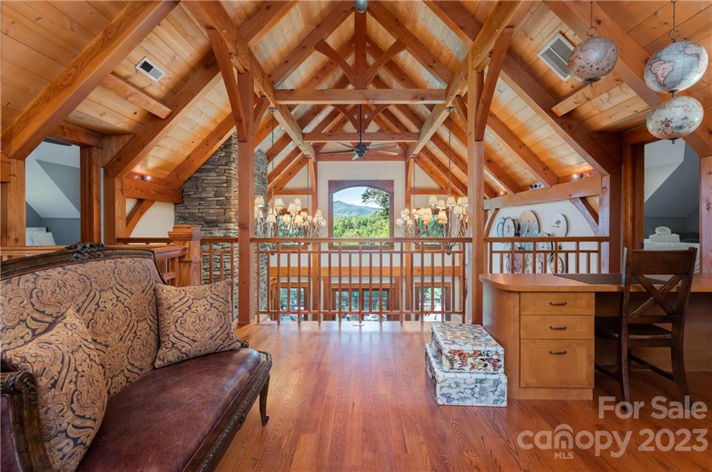649 Morgan Hill Road Fairview, NC 28730 - Photo 4 of 48 a view of a porch with wooden floor