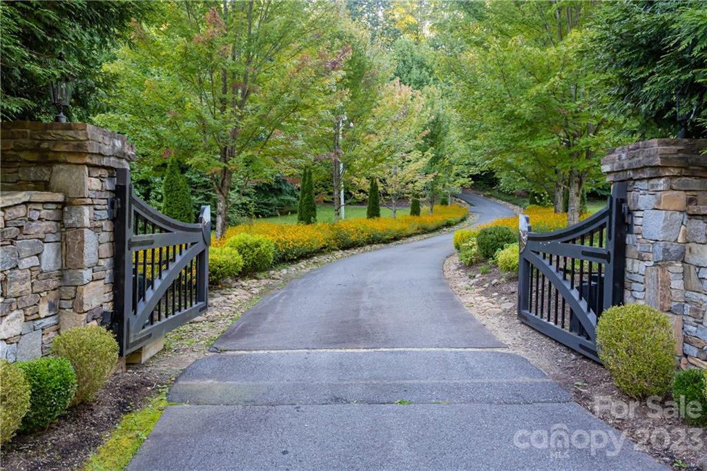 649 Morgan Hill Road Fairview, NC 28730 - Photo 47 of 48 a view of a pathway with a wooden bridge