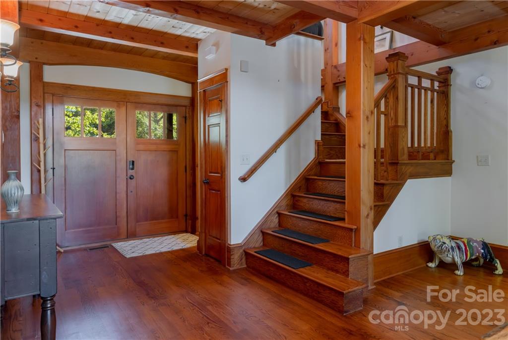 649 Morgan Hill Road Fairview, NC 28730 - Photo 7 of 48 a view of entryway with wooden floor and stairs