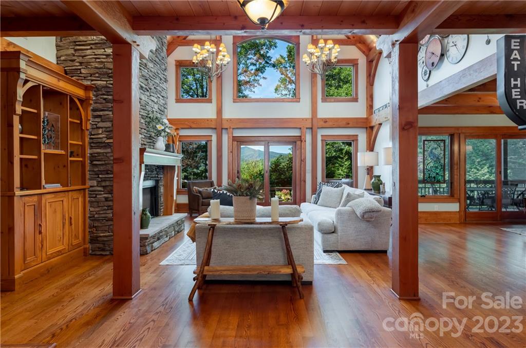 649 Morgan Hill Road Fairview, NC 28730 - Photo 8 of 48 a living room with fireplace furniture and a large window