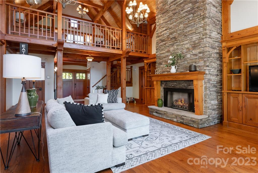 649 Morgan Hill Road Fairview, NC 28730 - Photo 10 of 48 a living room with furniture a fireplace and a rug