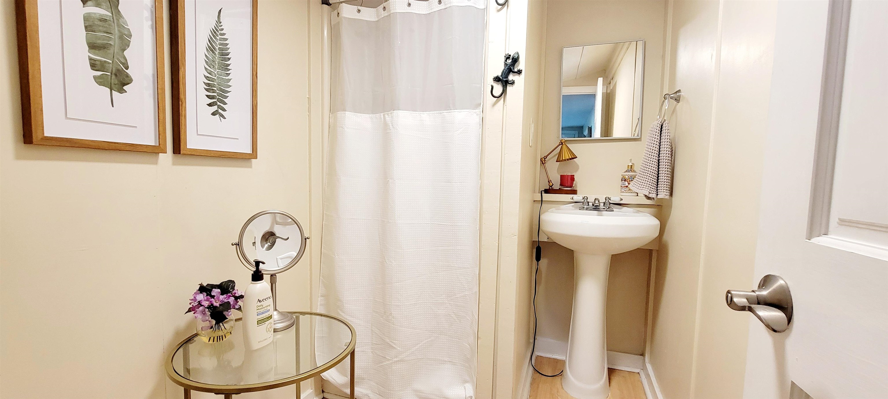 1295 Woodlawn Road St. Augustine, FL 32084 - Photo 11 of 19 a bathroom with a sink mirror and vanity