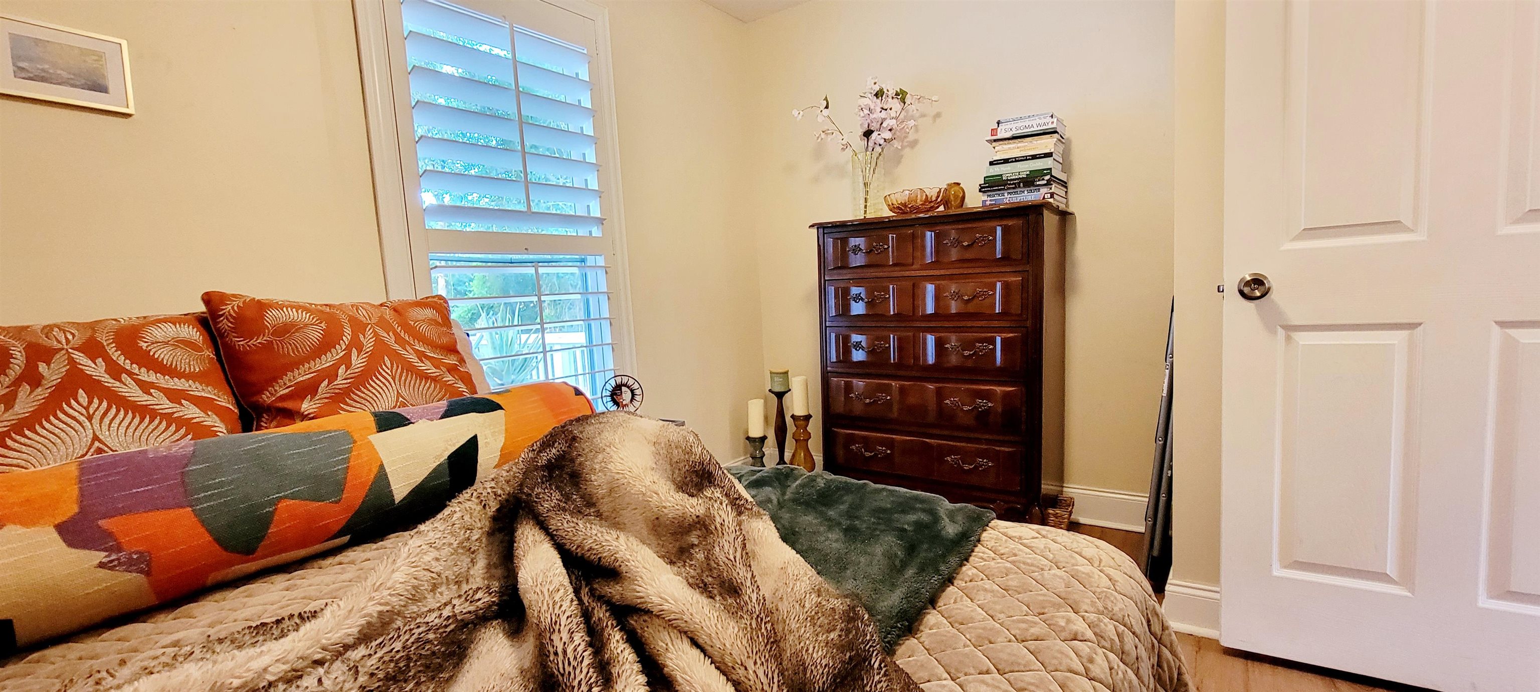 1295 Woodlawn Road St. Augustine, FL 32084 - Photo 13 of 19 a bedroom with furniture and a bed