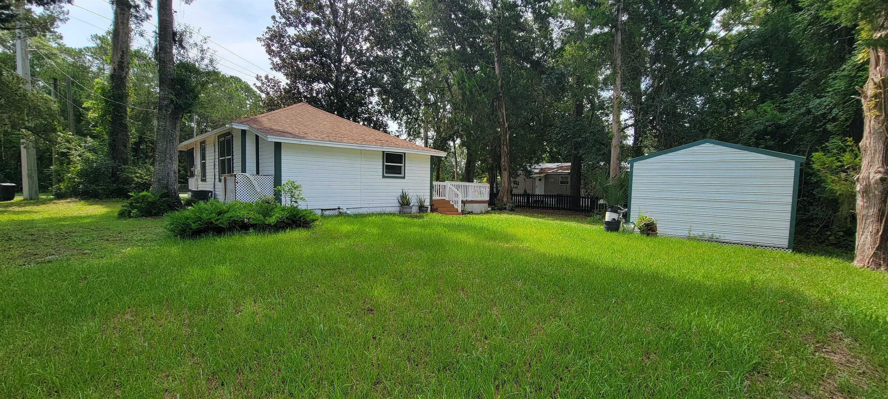 1295 Woodlawn Road St. Augustine, FL 32084 - Photo 18 of 19 a view of a house with a backyard