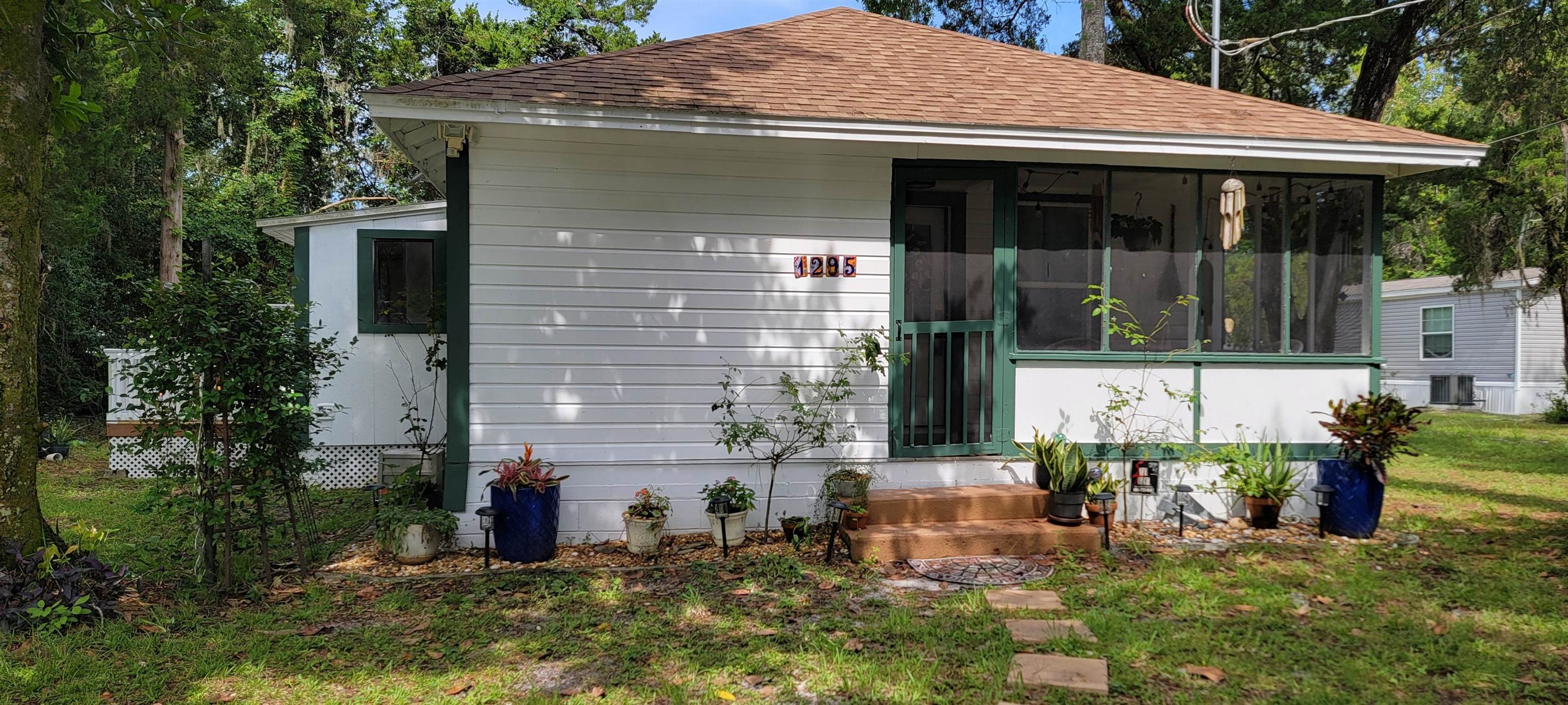 1295 Woodlawn Road St. Augustine, FL 32084 - Photo 19 of 19 a view of a house with yard and sitting area