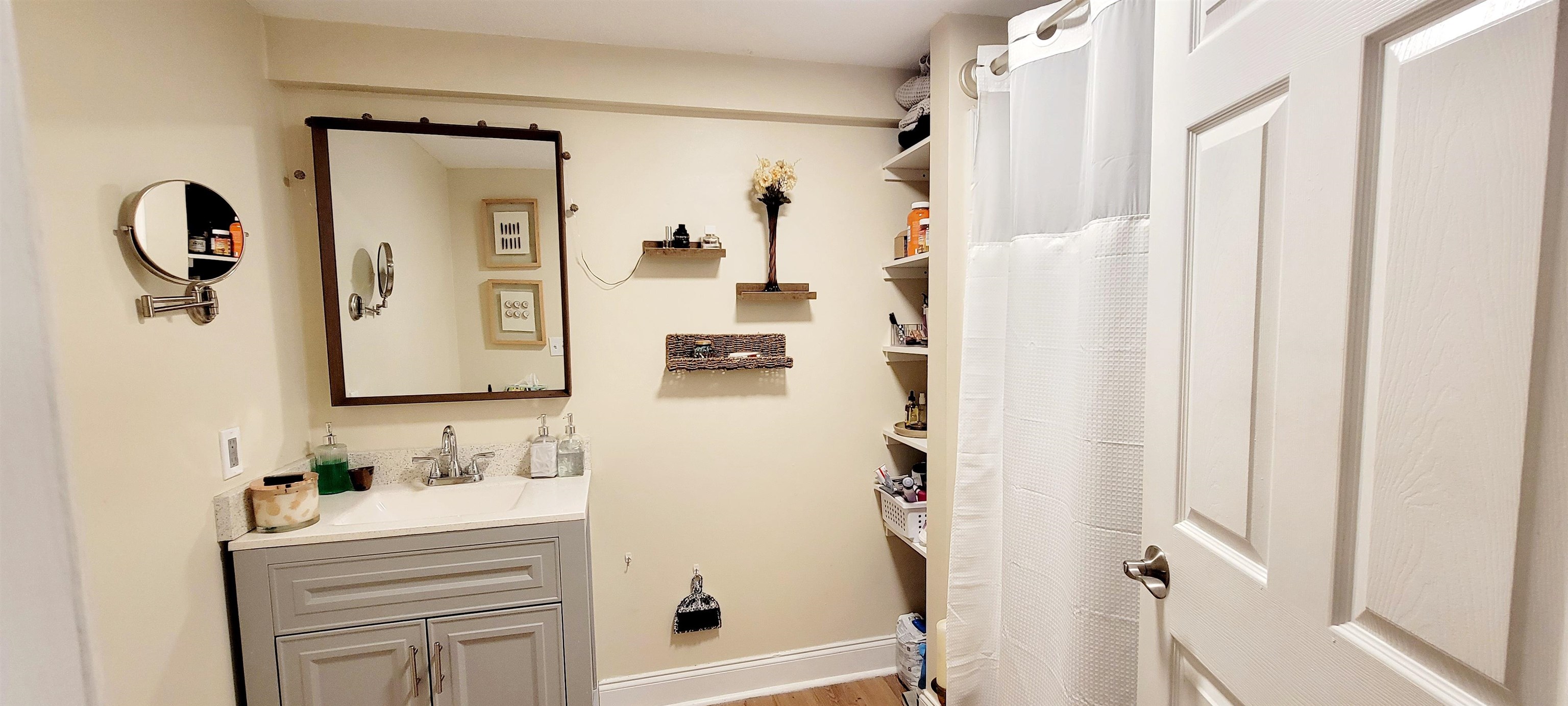 1295 Woodlawn Road St. Augustine, FL 32084 - Photo 5 of 19 a bathroom with a shower sink and mirror
