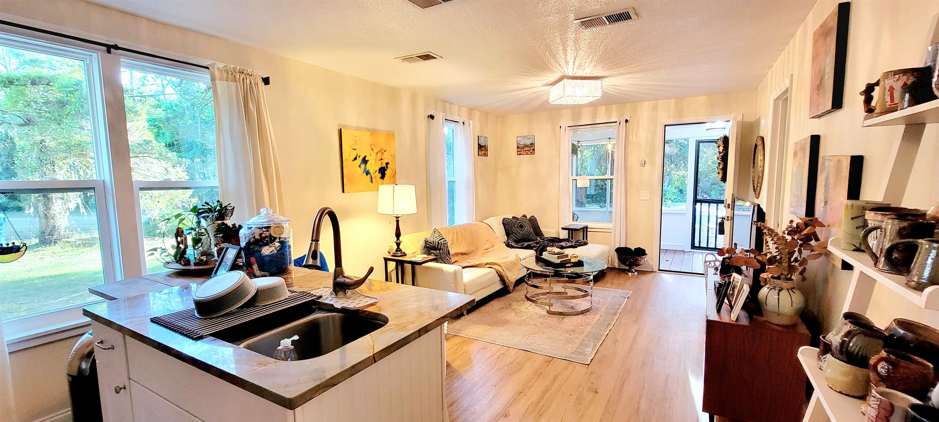 1295 Woodlawn Road St. Augustine, FL 32084 - Photo 6 of 19 a view of a living room and dining room