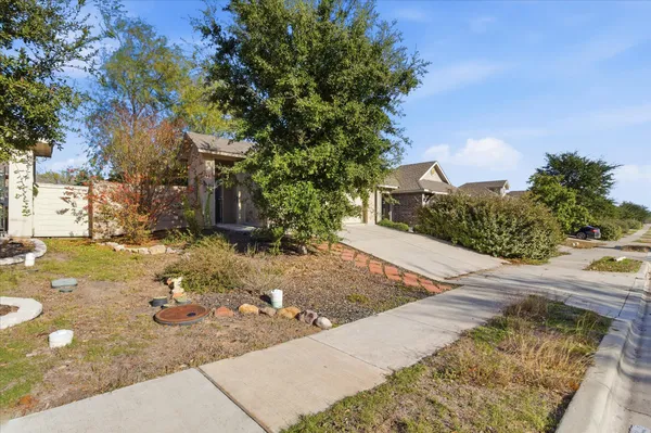 a view of a backyard of the house