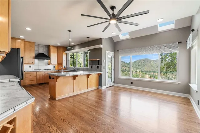 a view of kitchen with cabinets and wooden floor
