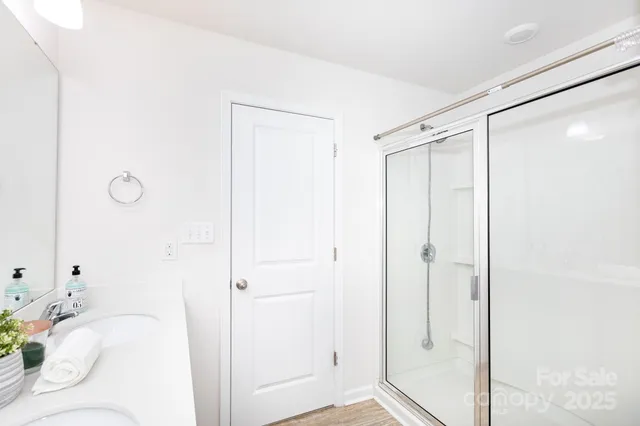 a bathroom with a bathtub and shower