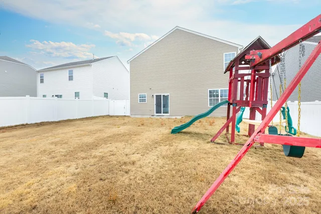 a view of multiple houses with city street