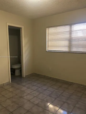 a view of a room that has a window in it