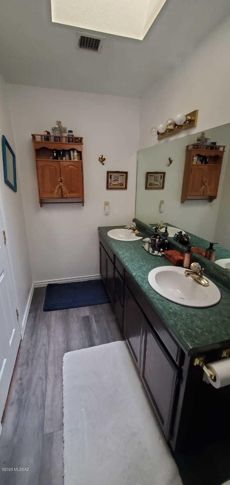 173 Nabo Court Rio Rico, AZ 85648 - Photo 21 of 26 a bathroom with a sink and a mirror