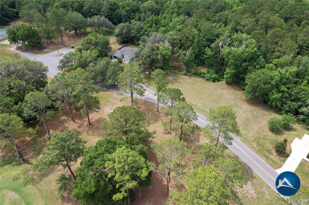 6214 Northwest 105th Avenue Alachua, FL 32615 - Photo 15 of 19 an aerial view of residential house with outdoor space and trees all around