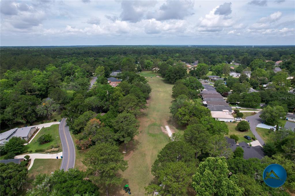 6214 Northwest 105th Avenue Alachua, FL 32615 - Photo 16 of 19 an aerial view of residential houses with outdoor space and trees