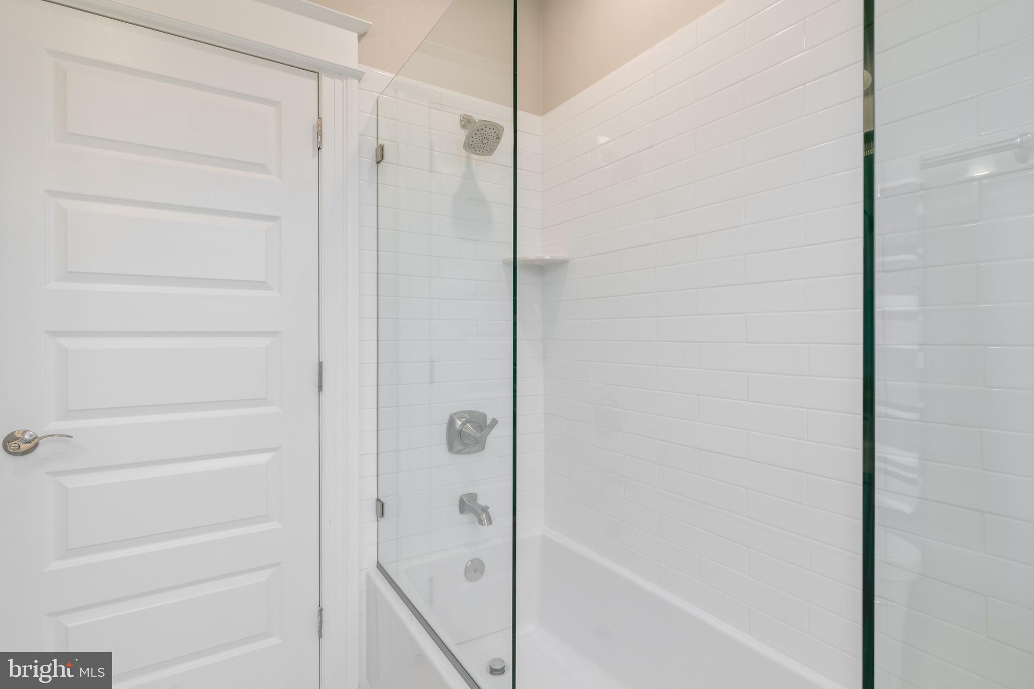 2407 Naylor Road Southeast Washington, DC 20020 - Photo 19 of 37 Tile tub with glass shower doors