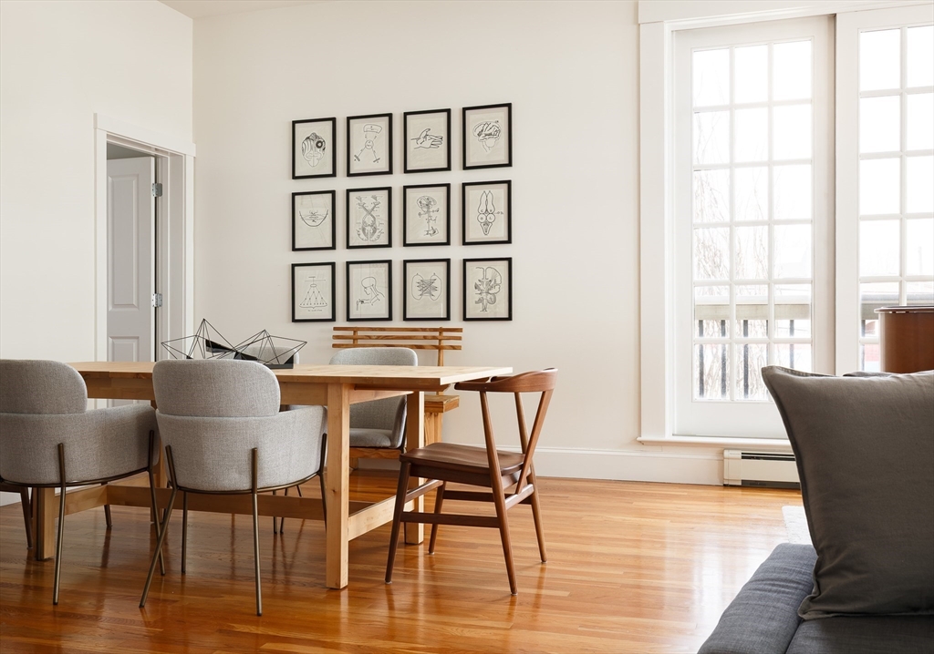 80 Webster Avenue, Unit 2A Somerville, MA 02143 - Photo 11 of 19 a view of a dining room with furniture and wooden floor