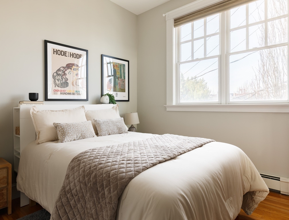 80 Webster Avenue, Unit 2A Somerville, MA 02143 - Photo 15 of 19 a bedroom with a bed and a window