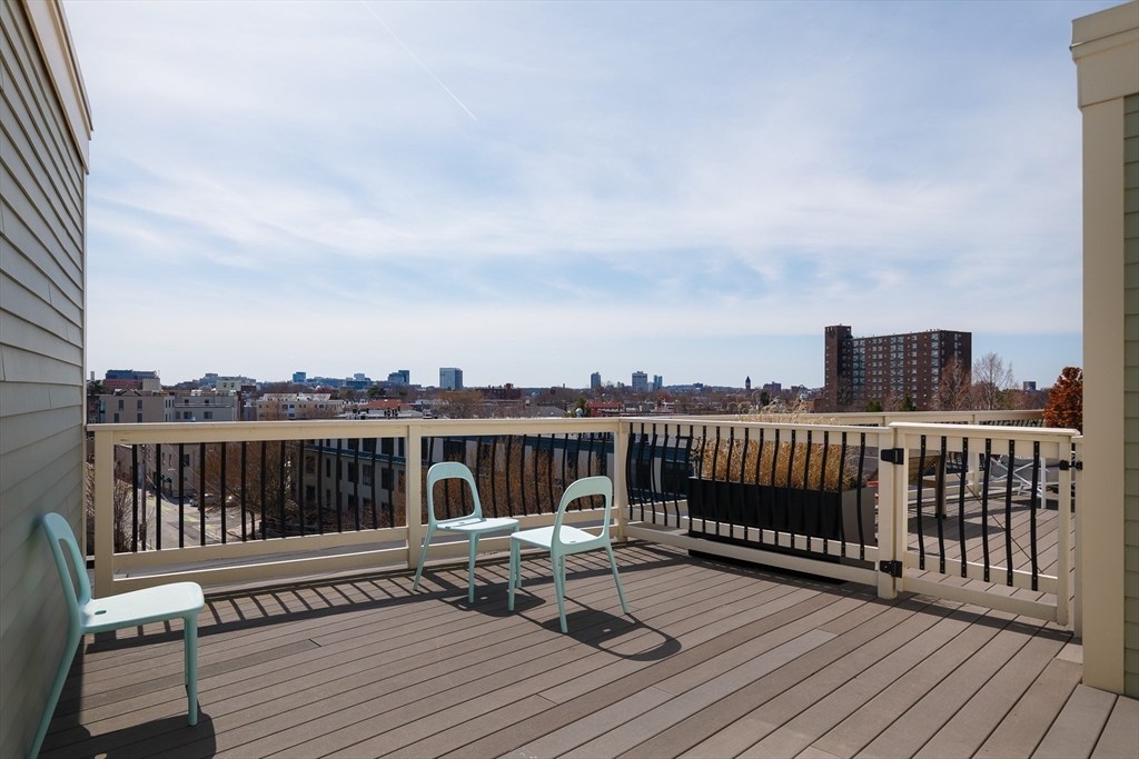 80 Webster Avenue, Unit 2A Somerville, MA 02143 - Photo 17 of 19 a view of a balcony with wooden floor
