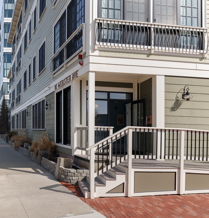 80 Webster Avenue, Unit 2A Somerville, MA 02143 - Photo 18 of 19 a view of a building with a outdoor seating