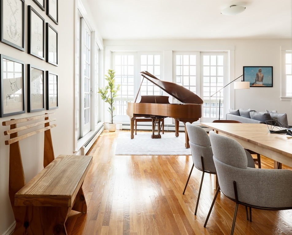 80 Webster Avenue, Unit 2A Somerville, MA 02143 - Photo 3 of 19 a living room with furniture and a wooden floor
