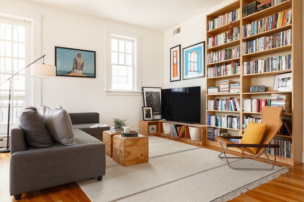 80 Webster Avenue, Unit 2A Somerville, MA 02143 - Photo 6 of 19 a living room with furniture and a flat screen tv