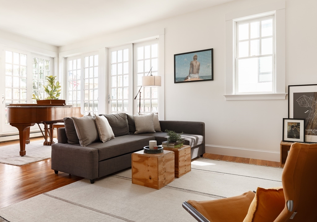 80 Webster Avenue, Unit 2A Somerville, MA 02143 - Photo 7 of 19 a living room with furniture and a window