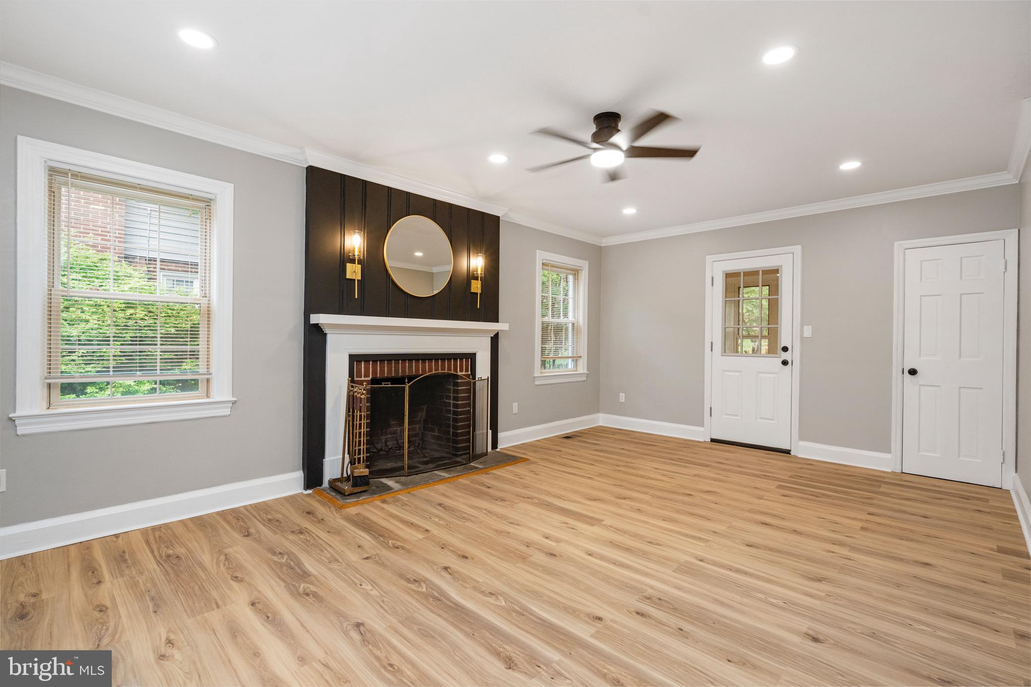 5311 Herring Run Drive Baltimore, MD 21214 - Photo 17 of 43 a view of an empty room with window and fireplace